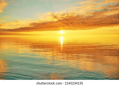 Bright Sunset Over Lake Geneva, Switzerland, Golden Clouds Reflect In The Water