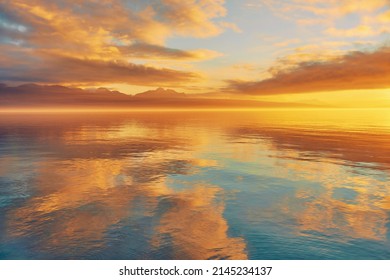 Bright sunset over lake Geneva, Switzerland, golden clouds reflect in the water