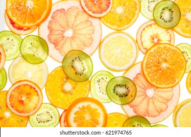 Bright Sweet Citrus Slices. Juicy Transparent Fruit On White