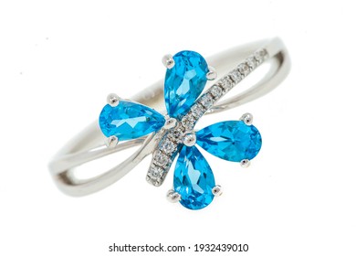 Bright Topaz In Jewelry. Ring With A Blue Stone Close-up Isolated On A White Background.