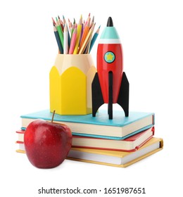 Bright Toy Rocket And School Supplies On White Background