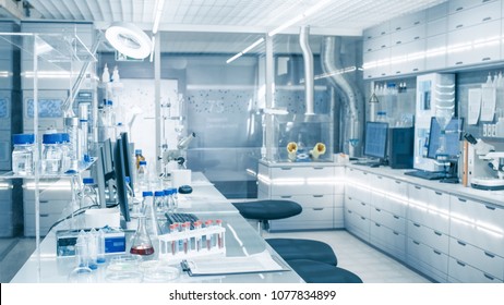 Bright and Ultra Modern High Tech Laboratory Full of Advanced Technological Wonders, Computers, Analyzing Machines, Test Tubes and Beakers. - Shutterstock ID 1077834899