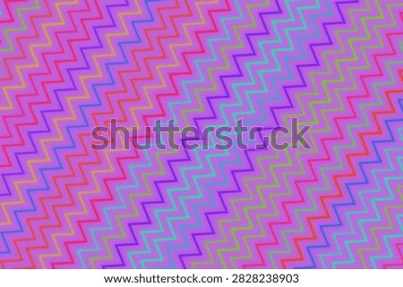 Bright and vibrant zigzag pattern in pink, purple, blue, and green colors, perfect for backgrounds and designs.