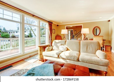 Bright Warm Colors Living Room With Rustic Furniture And Floor-to-ceiling Windows