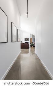 Bright white contemporary new home entrance hall to living room