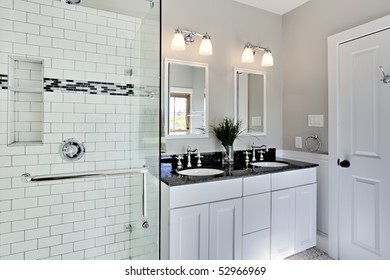 Bright White Remodel Bathroom. Glass Shower And Granite Counters.