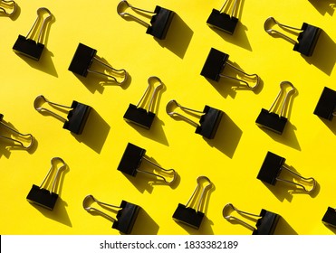 bright yellow pattern with office supplies. Graphic background with clips