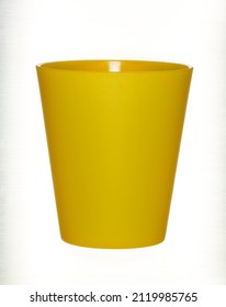 Bright Yellow Plastic Beaker Isolated On White Background