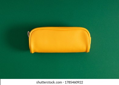 Bright yellow school pencil case, accessories on green background. Back to school. Flat lay, top view, copy space - Shutterstock ID 1785460922