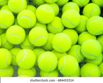 Lot Of Bright Yellow Tennis Balls As A Background