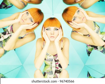 Bright young redhead woman in kaleidoscope of reflections