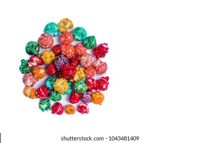 Brightly Colored Candied Popcorn, white background. Horizontal image of Junk food, fruit flavored popcorn. Colorful, rainbow, candy coated popcorn. Shallow focus on popcorn in bowl. Isolated on white 