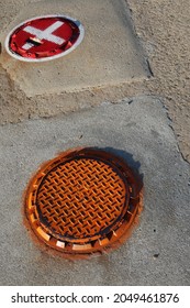 Brightly Colored Caps Over Underground Gas Tank