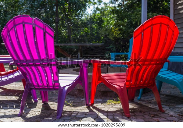 Brightly Colored Patio Chairs Around Fire Stock Photo Edit Now 1020295609