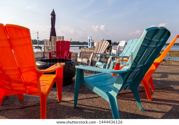 Brightly Colored Patio Chairs Positioned Around Stock Photo Edit