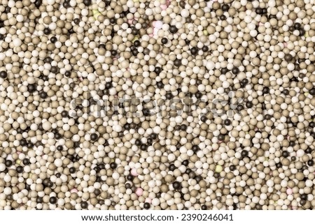 Brightly colored polystyrene beads texture as full-frame background. Colorful bright background, multi-colored balls. Sweet nice background candy.