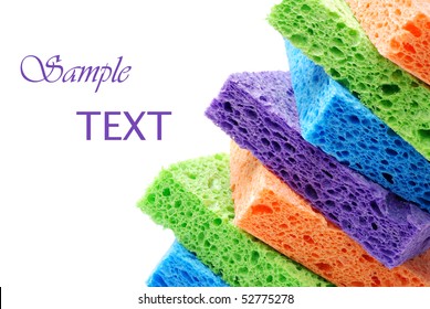 Brightly colored sponges on white background with copy space. - Powered by Shutterstock