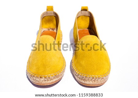 Brightly colored traditional slippers shoes espadrilles. Espadrilles isolated on White background