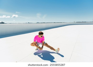 Brightly dressed man stretches on a flat rooftop under a clear blue sky in an urban setting - Powered by Shutterstock