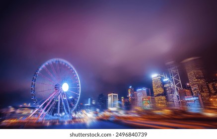 A brightly lit Ferris wheel stands in front of a blurry cityscape at night, with purple and pink hues in the sky. - Powered by Shutterstock