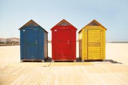 Brightly-coloured Beach Huts On Beach Oliva - Spain