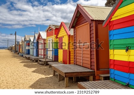 Brighton beach Victorian bathing boxes. Brightly painted colourful beach huts line the sand in Melbourne, Australia. They are highly desirable and extremely expensive real estate. 