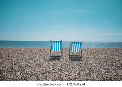 Brighton, East Success, United Kingdom - JULY 2, 2017: Two beach chair facing toward sea
