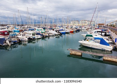BRIGHTON, ENGLAND - SEPTEMBER 08 2018: Yachts and boats in Brighton Marina, East Sussex, UK, residential and leisure complex on September 08, 2018 - Shutterstock ID 1183096540