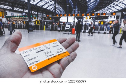 Brighton, England-18 October,2018: Hand Holding A UK Train Ticket At Brighton & Hove Train Station For Background In Brighton, England.