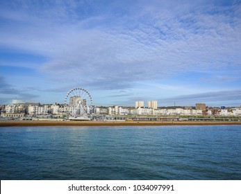 Brighton, England/UK-March 5th 2014: The Iconic Brighton Wheel On The Beach. Brighton Is A Famous Seaside Resort Town. Its Broad Shingle Beach Is Backed By Amusement Arcades And Regency-era Buildings.