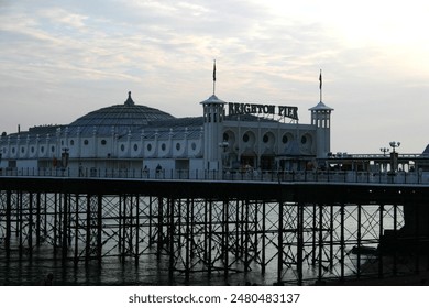 The Brighton Pier at dusk with riders - Powered by Shutterstock