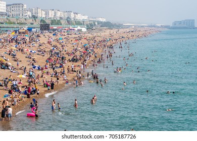 Brighton, UK - August 28, 2017: Brighton Beach Packed With People Enjoying The Sun And Bathing During A Late Summer Heatwave