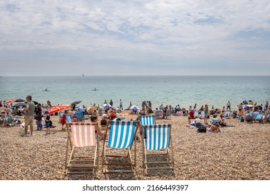 Brighton, UK - June 3 2022: Brighton Beach Seafront And Deck Chairs, East Sussex 