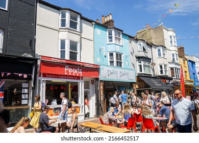 Brighton, UK - June 3 2022: People eating at cafes outside on Gardner Street, Brighton