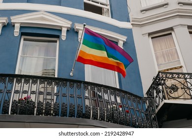 Brighton, United Kingdom - 08.06.2022: Lgbt Flag Hanging On The Balcony Of The House