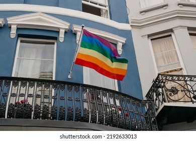 Brighton, United Kingdom - 08.06.2022: Lgbt Flag Hanging On The Balcony Of The House