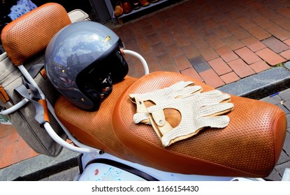 Brighton, United Kingdom - August 25, 2018: Mod Culture Scooter Seat With Gloves And Helmet