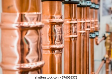 Brilliant new copper pipes. Connection of copper pipes blooming fitting.