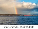 Brilliant rainbow over the water in Ruston, Washington.