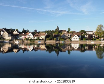 Brilliant Rhine River in european STEIN AM RHEIN town in SWITZERLAND, canton Schaffhausen, clear blue sky in 2018 warm sunny summer day on August. - Shutterstock ID 2102833219