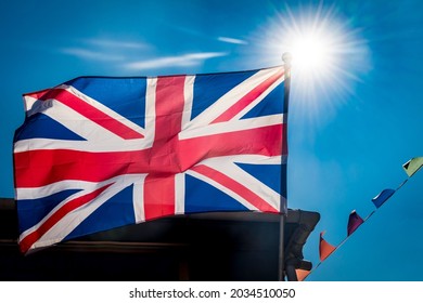 Brilliant Sunshine Behind Great Britain Flag And Bunting