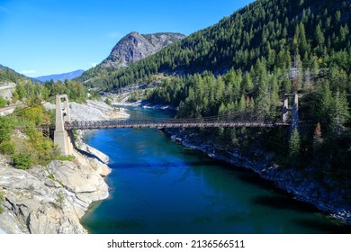 The Brilliant Suspension Bridge is a suspension bridge over the Kootenay River near Castlegar, British Columbia. The bridge was declared a national historic site in 1995.  - Shutterstock ID 2136566511