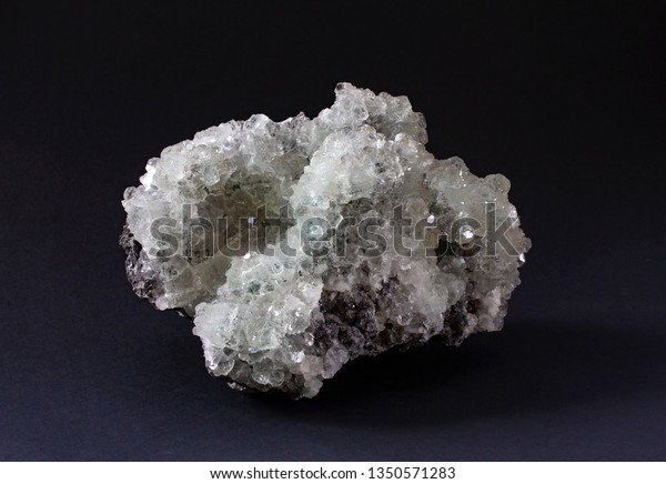 Brilliant tetrahedrite mineral specimen with\
cluster of cubic white crystals. Tetrahedrite is a copper antimony\
sulfosalt mineral.