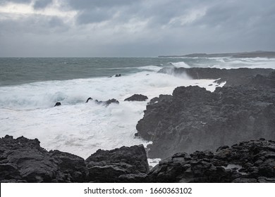 Brimketill Lava Rock Pool Iceland Storm Waves Hitting Black Basalt Rock