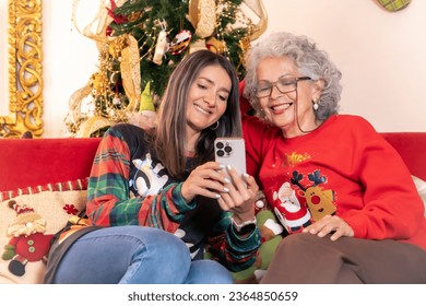 Bringing Christmas Hearts Together Through the Screen: Mother and Daughter Celebrate with Loved Ones in an Emotional Video Call - Powered by Shutterstock