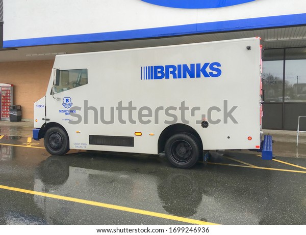 \
Brinks Armored security car makes pickup of daily\
earnings from local supermarket, Revere Massachusetts USA, April 9,\
2020