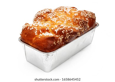 Brioche with grains of sugar in baking mold isolated on white background