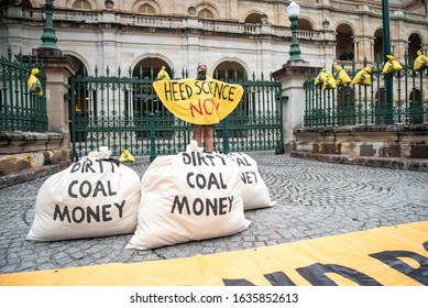 Brisbane, Australia. 04th Of February, 2020.Money And Dirty Coal Money Bags Are Dumped By Protesters In Front Of Queensland Parliament.
Extinction Rebellion Protesters Actions