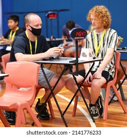 Brisbane, Australia - APRIL 02 2022: Brisbane Autumn 2022 Speedcubing Competition, Competitor Mid Solve 3x3x3 Cube Event, First Round.