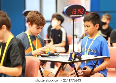 Brisbane, Australia - APRIL 02 2022: Brisbane Autumn 2022 Speedcubing Competition, Competitor Mid Solve 3x3x3 Cube Event, First Round.